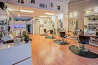 Chairs facing mirrors in a beauty salon.