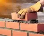 Bricklayers laying bricks building houses etc.