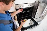 Repairing a cooker oven.