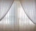 Pair of curtains in a window.