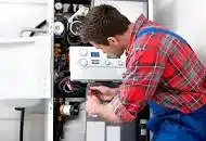 Agas engineer serving a gas boiler.