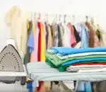A pile of Laundry just been ironed in an ironing and laundry business.