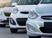Cars Lined Up On A Used & New Car Dealers Forecourt.
