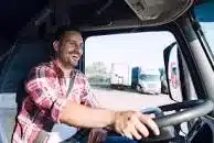 A driver recruitment agency worker driving a lorry.