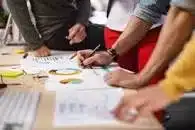 People thinking of a marketing strategy at a marketing agency.