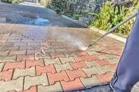 A patio being steam cleaned.