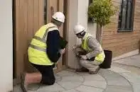 2 people snagging a new build property.
