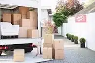 Removal Boxes coming off a van to go into storage.on