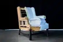 Showing what is under the cloth on an upholstery chair.