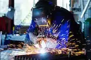 A welder welding in their worksop