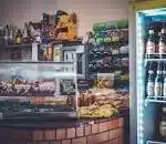 A convenience store selling all foods and drinks and stationary goods.