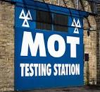 Sign saying where an MOT testing stasion is.