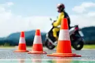 Motorcyclists being instructed by a motorcycle instructor on how to ride their motorcycle safely.