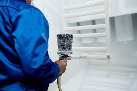aAn item being sprayed with a powder coating.