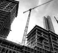 Showing construction work going on building high rise apartments.