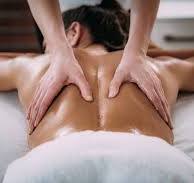 Sports person having muscle relaxation from a sports therapist
