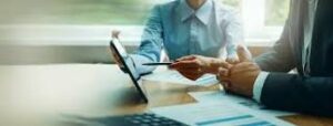 Business Consultants holding a meeting to find the best way frorward to progress a business.