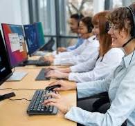 Row of people on the telephone making calls to sell products.
