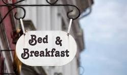 Sign outside a bed & breakfast saying vacancies.