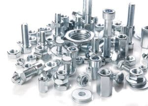 chromeplated bolts and nuts on white background