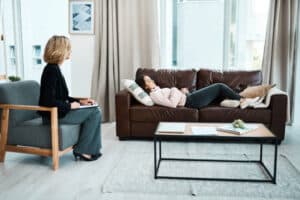 A client having a hypnothwrapy session with a hypnotherapist.