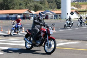 Motorcyclists being instructed on how to ride a motorcycle safely by the motorcycle instructors.