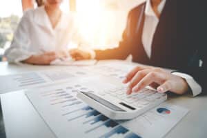 Picture of 2 accountants working and calculating expenses